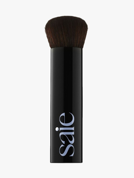 Saie The Base Foundation Brush black foundation brush on light gray background
